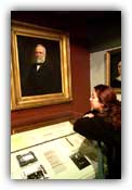 Daphne stares at Carnegie's portrait and wonders about his split personality
