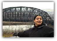 Nick on the banks of the Ohio River with a very common Steel bridge in the back round