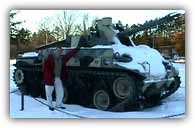 Posing in front of a US tank, Stephen reveals he is part of a generation of youth far removed from the realities of war