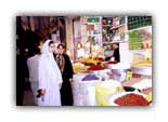 Neda and her mom look at spices in Iran